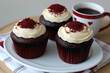 © Suaib - Three frosted cupcakes arranged with a mug of coffee present