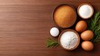 © Chananphat - In a wood kitchen, the baking recipe calls for ingredients like eggs, flour, and sugar, mixed in bowls for cooking delicious treats.