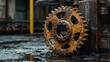© SM Graphics - A close-up of rusty machinery setting on a dirty factory floor, hinting at a hard-working past in a factory or workshop.