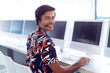 © WavebreakMediaMicro - Customer service representative smiling while using headset at computer in office, copy space