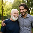 © sangram - A heartwarming moment between an elderly man with a white beard and a younger man with dark hair, both smiling and laughing together outdoors