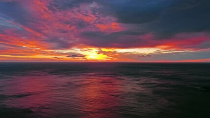 Wall Mural - dramatic red sunset and sea beach in dusk, tracking shot 4k