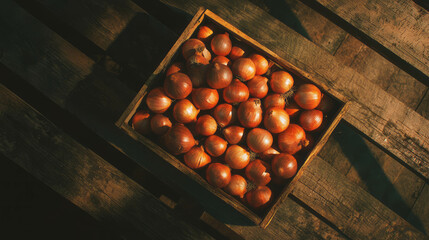 Poster - Rustic wooden crate filled with fresh onions in warm sunlight