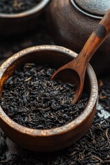 Poster - A traditional wooden bowl filled with black tea and a wooden spoon