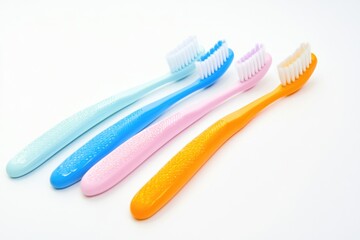 Poster - Set of vibrant toothbrushes arranged on a clean white background, ideal for use in illustrations about oral care or as decorative elements