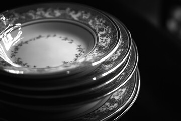 Poster - A collection of plates stacked high, suitable for use in food or lifestyle images
