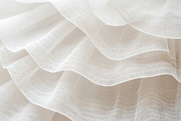Aufkleber - A close-up view of a white dress with ruffles