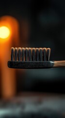 Poster - Close-up shot of a toothbrush with a bright light in the background, ideal for use in beauty or health-related contexts