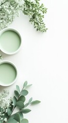 Poster - Elegant green bowls surrounded by delicate foliage on a light background for a serene and calming atmosphere