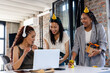 © Wavebreak Media - Diverse female colleagues celebrating at office, wearing party hats and sharing joyful moments