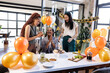 © Wavebreak Media - woman celebrating birthday with diverse female colleagues in modern office