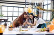 © Wavebreak Media - Female diverse colleagues celebrating birthday with cake and gifts in modern office setting
