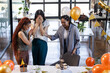 © Wavebreak Media - Female diverse colleagues celebrating surprise party in office with balloons and cupcakes