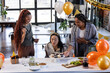 © Wavebreak Media - Celebrating birthday at office, diverse women enjoying cupcakes and decorations