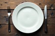 © Withun - Empty plate with utensils, signifying abstinence, medical fasting, cleansing, white