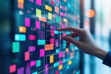 Poster - A hand touching a touch screen with colorful squares representing agile software development tools and user engagement
