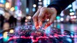 © uchiha - Hand Touching Illuminated Tablet Screen in Modern Urban Environment at Night