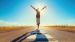 © Ant - A cyclist performs a wheelie on a sunlit road, celebrating freedom and adventure under a clear blue sky.
