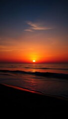 Wall Mural - silhouetted beach at sunset, tranquil ocean waves reflecting peaceful sky, water, waves, peace