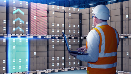 Poster - Man storekeeper among pallets with boxes. Warehouse employee at work. Storekeeper determines cargo to be transported. Man warehouse manager stands with laptop in hands. Parcels are stored in hangar