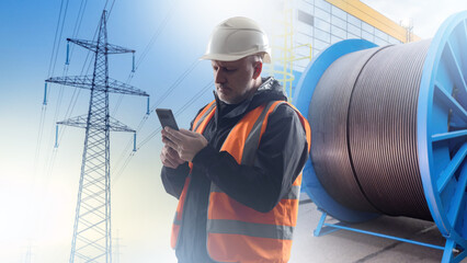 Poster - man electrification specialist. high voltage power line. reel with thick electrical cable near worke