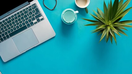 Poster - Creative Workspace With Laptop and Plant on Blue Desk Surface Generative AI