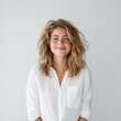 © khonkangrua - Bright Smiling Young Woman with Flowing Hair Posing in Minimalist Space Against Light Background
