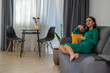 © svetograph - Woman Relaxing Apartment Sofa Leisure: Cozy Home, Evening Relaxation, Modern Living Room.