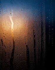 Wall Mural - captivating close-up view of intricate condensation patterns forming on a cold glass surface, emphas