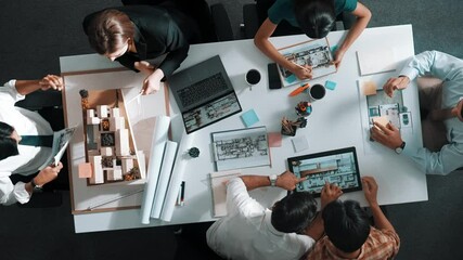 Poster - architect team discussing and pointing and presenting blueprint to interior designer. aerial view pr