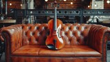 Violin resting on a vintage leather sofa in a cafe