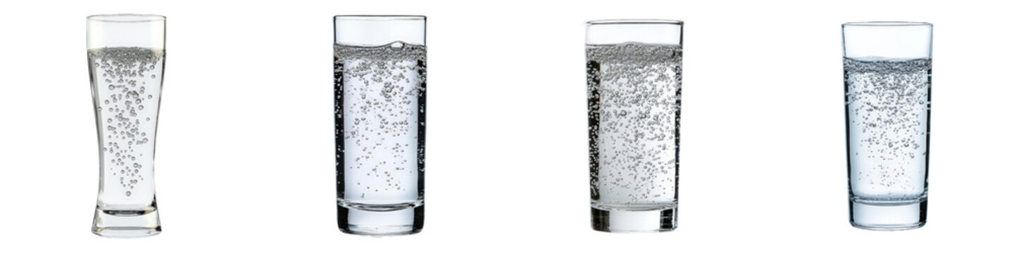 Four clear glasses filled with sparkling water showcasing bubbles