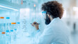 © praewpailyn - scientist laboratory is focused writing complex formulas glass surface, surrounded by laboratory equipment and glassware. atmosphere is bright and modern, reflecting sense of innovation