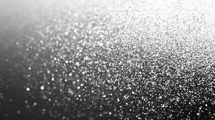 Poster - A mesmerizing close-up of shimmering silver glitter particles creating a sparkling effect against a dark background