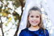 © Austockphoto - Portrait of a child playing dress ups as a princess with a silver tiara