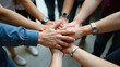 © HaJung - Close-Up of Students Stacking Hands Together: A Symbol of Teamwork and Collaborative Success in Educational Projects - Perfect for Startup Concepts with Space for Text