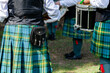 © Austockphoto - Drummers in band wearing kilts