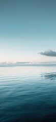 Wall Mural - Calm waters under a serene blue sky