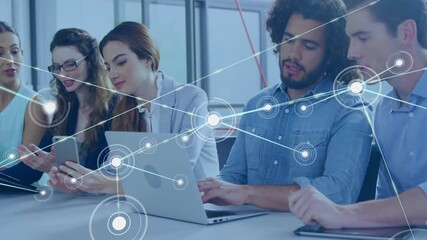 Poster - Working on laptops, diverse group with network connections overlay in office