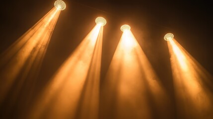 Poster - A close-up of stage lights positioned on a black backdrop, shining brightly with space above for text.
