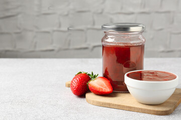 Wall Mural - delicious strawberry sauce and fresh berries on light table. space for text