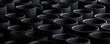 © Aris Suwanmalee - Abstract black cylindrical shapes.