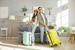 © Studio Romantic - Young tourist couple, happy planning bright summer trip holiday beach near packed luggage bag for vacation travel, things into big suitcases, family dreaming of travelling, honeymoon destination