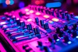 © Woranuch - Close-up of a DJ Mixer Console Under Vivid Pink and Blue Lighting. This vibrant image showcases the intricate details of the audio mixing equipment.