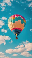 Wall Mural - Colorful Hot Air Balloon Floating in a Clear Blue Sky