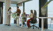 © BGStock72 - Business professionals collaborate in a modern office setting during a productive meeting