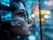 © Mateusz - Visionary's Gaze: A young woman with glasses is absorbed in the digital displays of tomorrow, as her eyes reflect a vision of innovation and future technology.