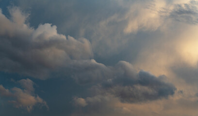Wall Mural - beautiful bright evening sunset sky with dark clouds. sunset sky background.
