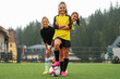 © Malik Nalik - A happy female soccer team together on the stadium field.