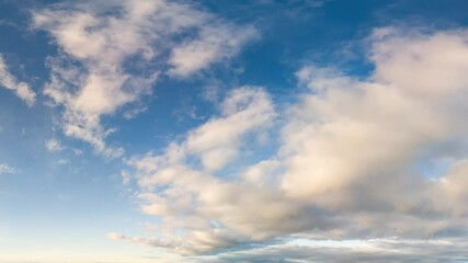 Wall Mural - Clouds Timelapse: Seamless Loop of White Clouds Drifting Across a Vibrant Blue Sky
